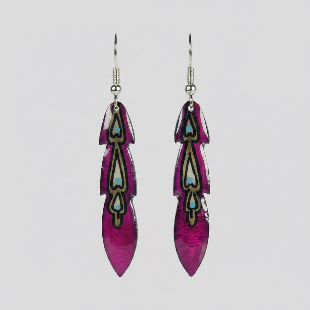 A pair of purple and black moose antler feather earrings against a beige background.
